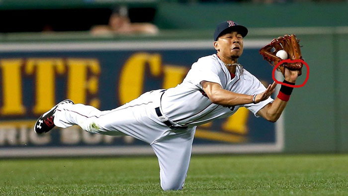 Red Sox right fielder Mookie Betts shows palm